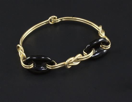 An 18ct gold and black onyx bracelet, gross 21.8 grams.